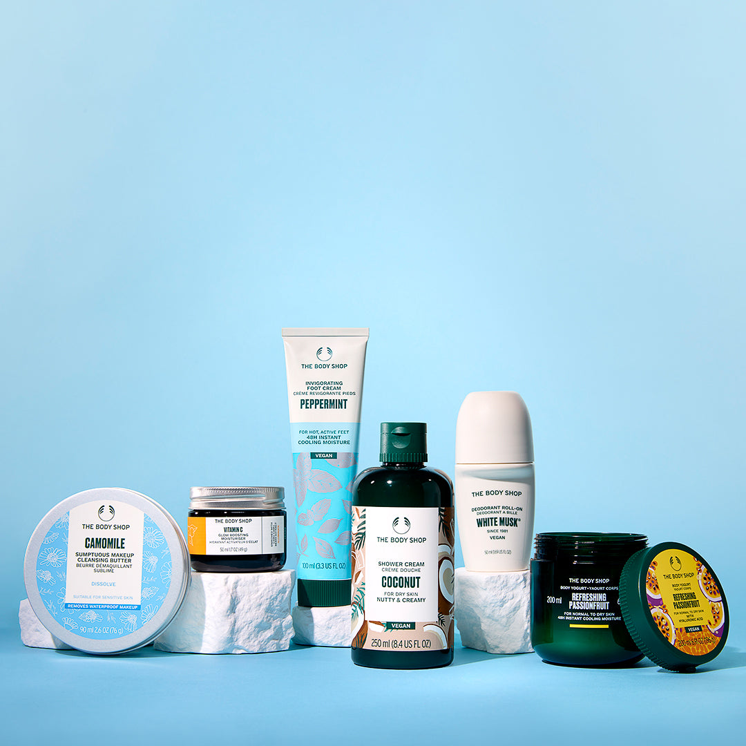 Collection of The Body Shop products on a blue background