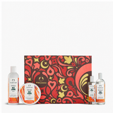 Cosmetic set with a patterned box and bottles on a white background