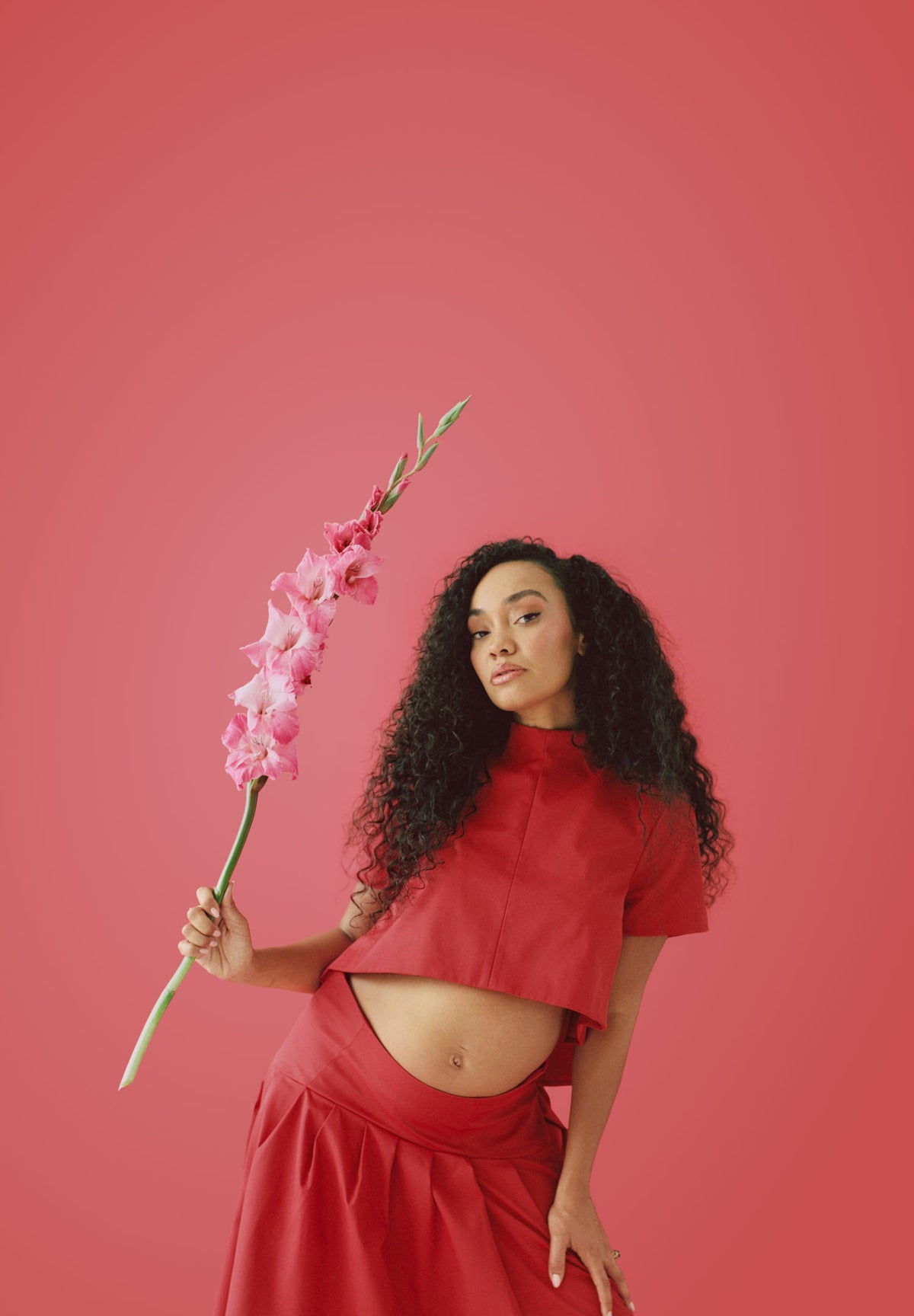 Leigh-Anne Pinnock holding a wildflower